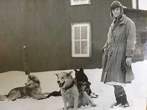 With her sled dogs