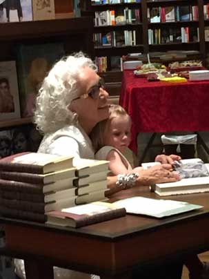 Merilyn Simonds, author, with her granddaughter, at a book signing